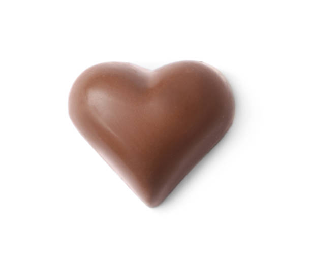 istock Heart shaped chocolate candy isolated on white, top view 1341079761