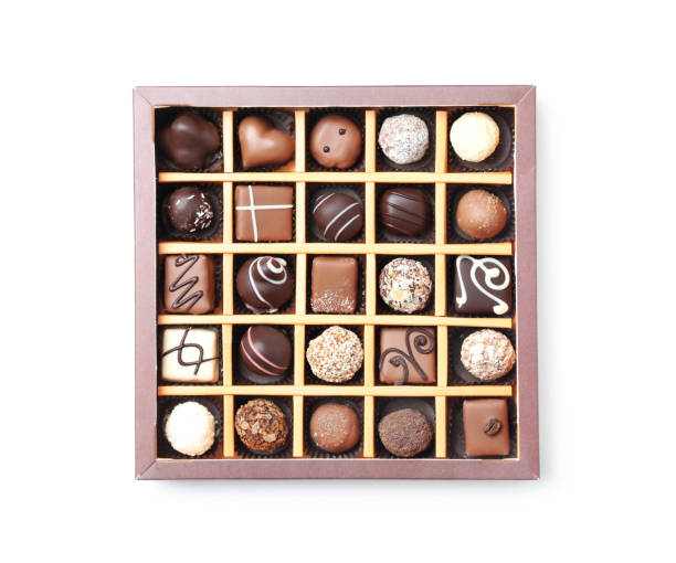 istock Box with tasty chocolate candies isolated on white, top view 1341079840