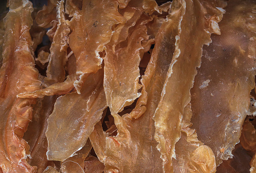 close up of a retail display of dried fish bladder, sold at a traditional Chinese medical store in Chinatown, Manhattan, NYC