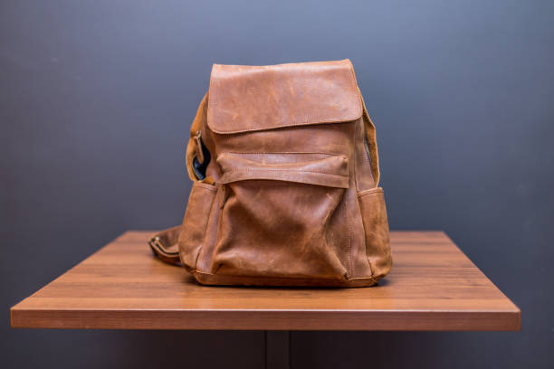 istock Brown leather backpacks on wood table 1341081126