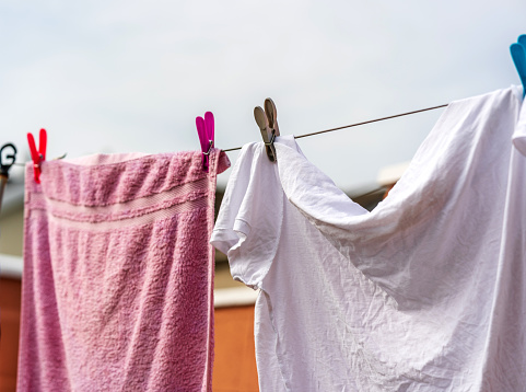 Washing line with towels drying in the garden UK