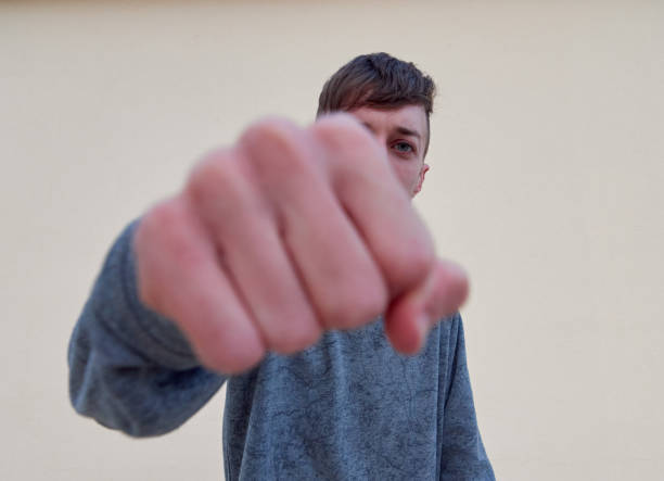 istock A young Caucasian male from Spain punching on plain background 1341082233