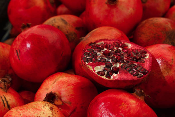 istock Fresh red ripe pomegranates close up 1341085287