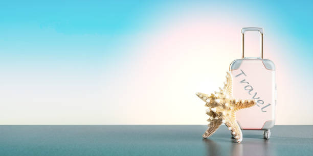 istock Pink suitcase with seashell over blue background with copy space. Banner. Summer vacation and travel concept. 1341086433