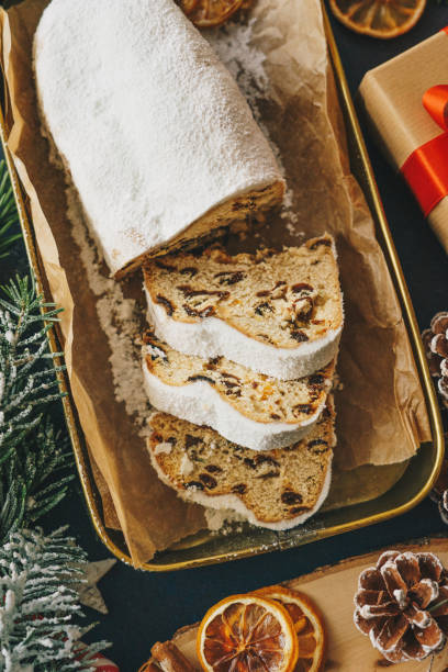 istock Sliced Christmas stollen with decoration 1341086505