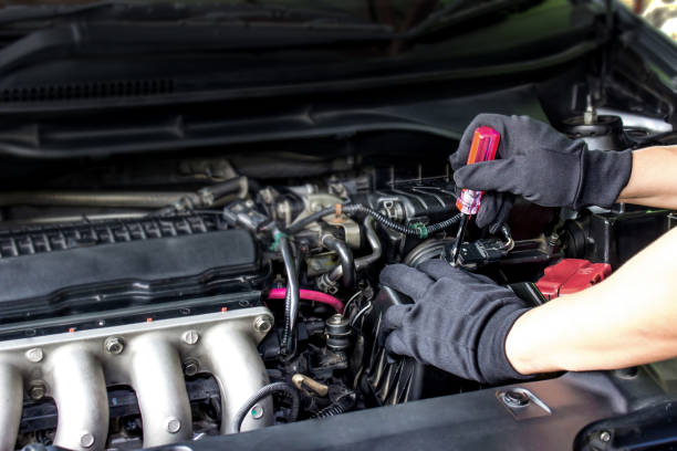 istock Technician use screwdriver remove a bolt of airflow sensor in the engine room car for check and cleaning in service concept 1341086555