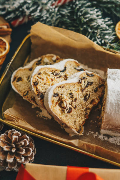 istock Sliced Christmas stollen with decoration 1341086886