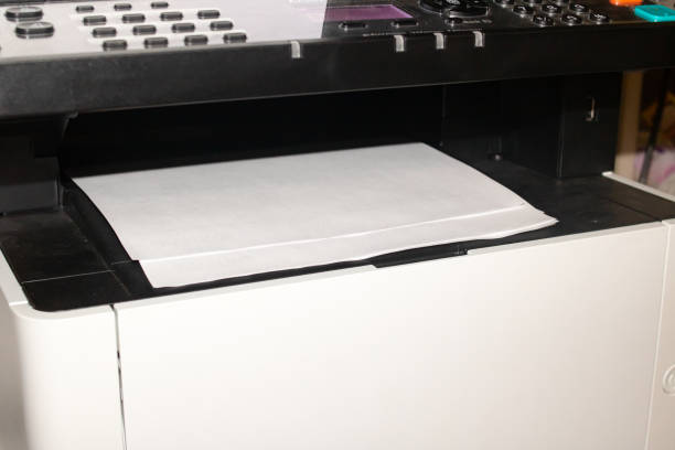 istock Sheets of paper in the scanner closeup 1341087907