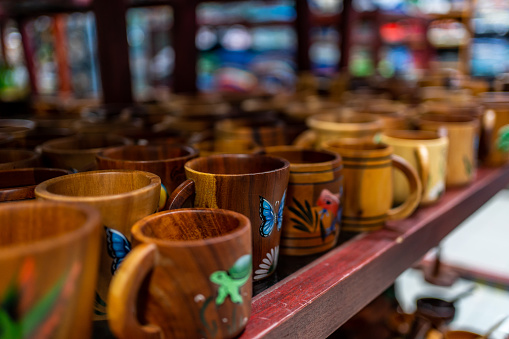 Carved and painted wooden mugs at a market stall. Costa Rica