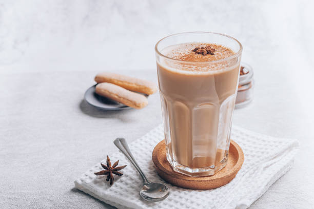 masala tea indian drink with spices spice chai copy space a glass of milk tea or coffee latte chai stock pictures, royalty-free photos & images