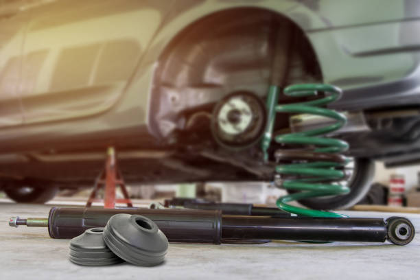 istock Chang Coil spring and shock absorber on the service shop change and remove old part car maintenance concept 1341090322