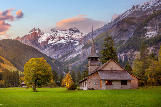 Kandersteg, Switzerland sunset church, mountains, Sunset snow Swiss Alps mountains panorama and St. Mary Church, Kandersteg, Switzerland lake oeschinensee stock pictures, royalty-free photos & images