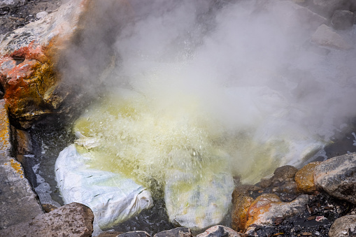 Corn being boiled in a volcanic spring in a public park in the center of Furnas on the Portuguese Azorean Island San Miguel in the center of the North Atlantic Ocean