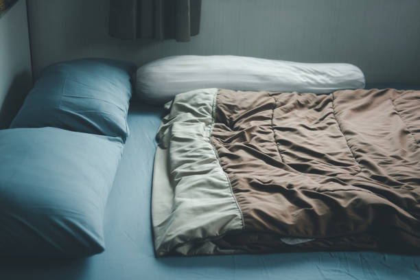 istock Bedroom with comfortable bed clean linen in home 1341093992