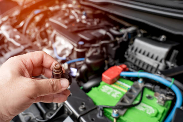 istock Technician check hole on old the gasoline injector part in engine room check dust and test pressure in process maintenance concept 1341095379