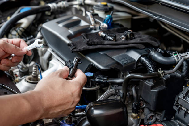 istock Technician Removing the gasoline  injector part in engine room check dust and test pressure in process maintenance concept 1341095447