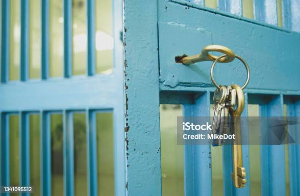 The Prison Door With The Keys In The Lock Stock Photo - Download Image Now - Arrest, Behind, Building Entrance