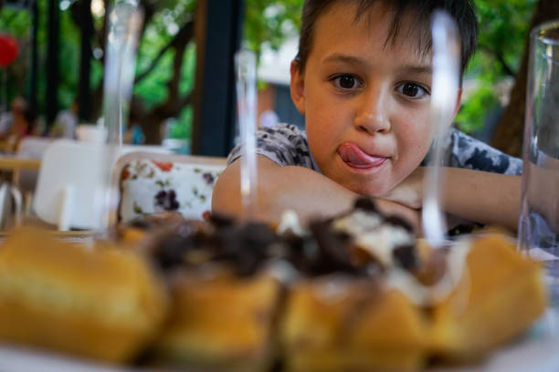 Boy show us what will eat after a winning tennis match