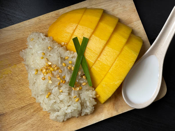 Steamed glutinous rice with mango and coconut milk