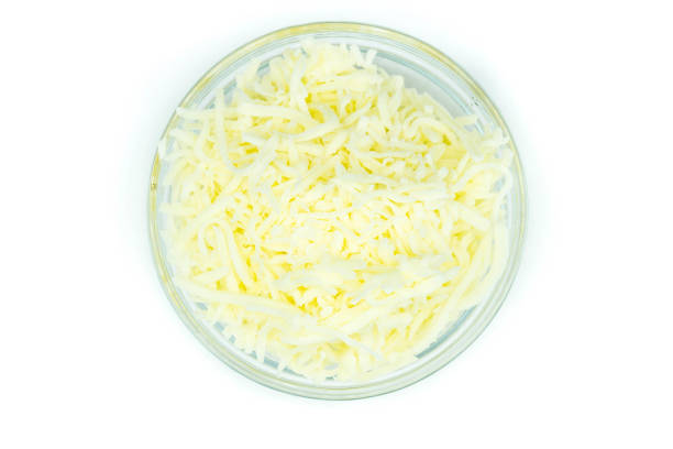 istock cheese in bowl isolated on white background top view 1341099176
