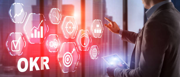 istock Man Hand touching OKR inscription, 2021 technology concept 1341105385