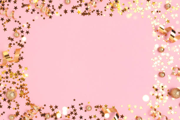 istock Border frame made of gold colored confetti. 1341106498