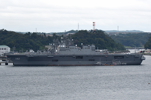 Yokosuka, Japan - May 25, 2023 : JS Izumo (DDH-183) at the Japan Maritime Self-Defense Force's base in Yokosuka, Kanagawa Prefecture, Japan.