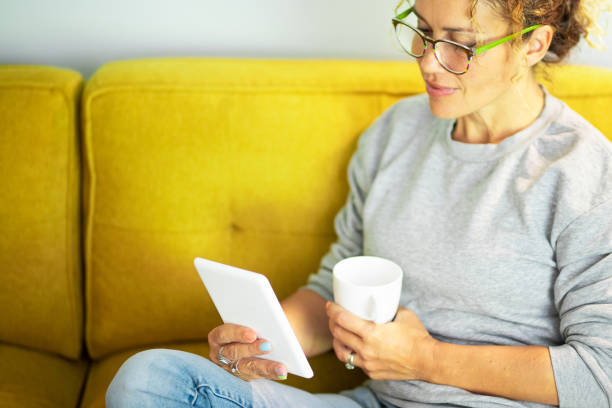 istock Midsection Of Woman Holding Coffee Cup 1341108980