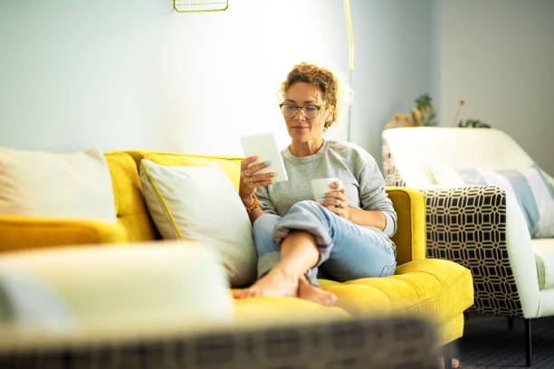 istock Man Sitting On Sofa At Home 1341108984