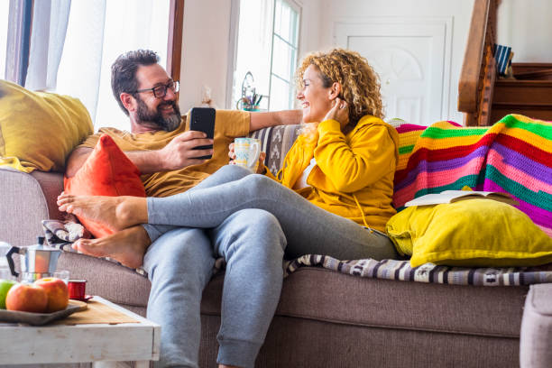 istock People Sitting On Sofa At Home 1341109283