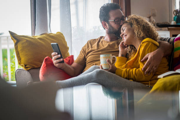 istock Couple Holding Mobile Phone 1341109355