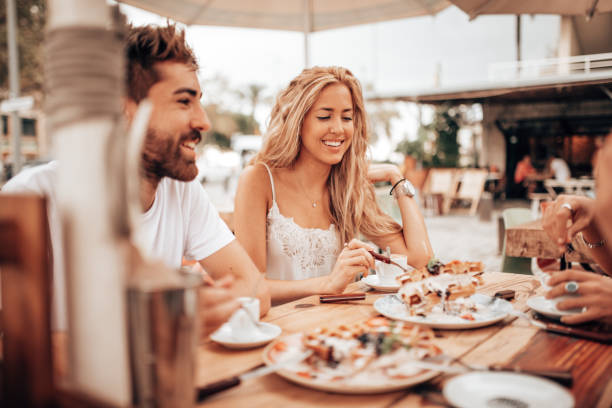 istock mixed racial friends doing breakfast at the cafe 1341112193