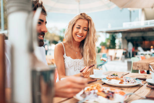 istock mixed racial friends doing breakfast at the cafe 1341112415