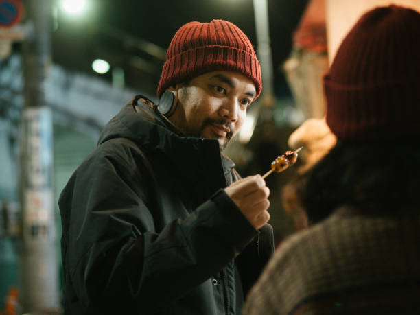 istock Hipster man tourists enjoy to eating. 1341113255
