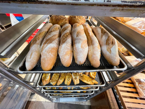 istock Group of toasted baguette on toast racks 1341114255