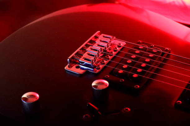 istock Electric guitar and red lights 1341117737