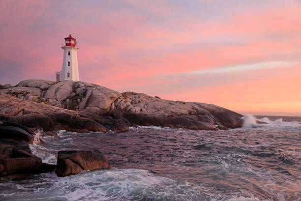 istock Peggy’s Cove Lighthouse illuminated at dusk with reflection in water, Nova Scotia, Canada 1341117761