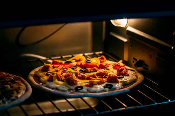 Grilled pizza in oven stock photo