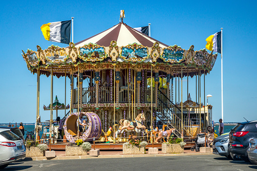 Old carousel on the jetty d'Eyrac in Arcachon during summer