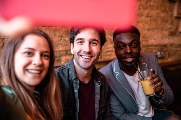 istock Three friends spending great time together in a pub 1341120405