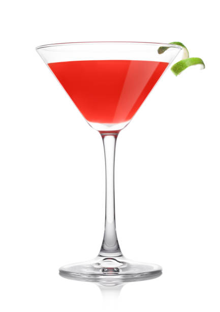 istock Cosmopolitan cocktail in classic crystal glass with lime peel on white. 1341122916
