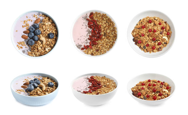 istock Set of different granola breakfasts with berries on white background 1341125534