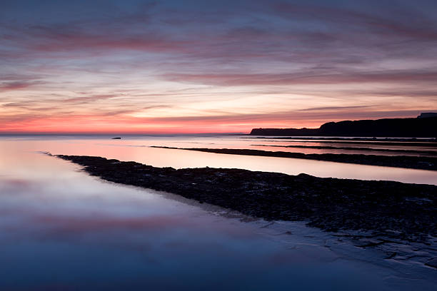 Sunset across Kimmeridge Bay, Dorset, UK stock photo