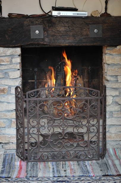istock Fireplace in the house with fire lit 1341126620