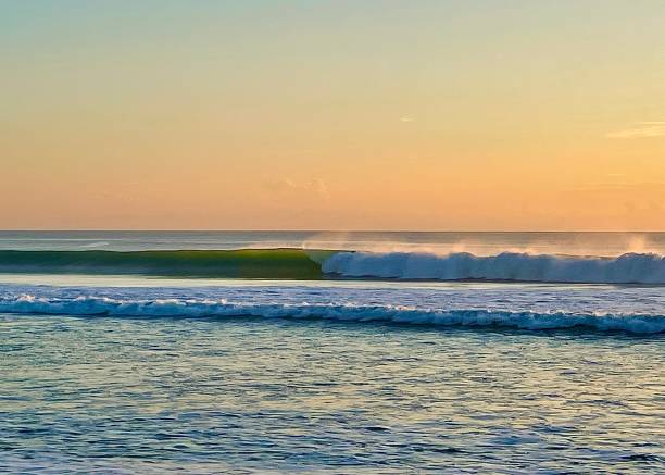 istock Waves at the beach tropical dusk 1 1341130825