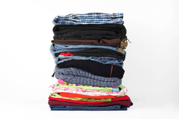 istock Clothes and accessories - group stack pile of colorfull jeans white background 1341132254