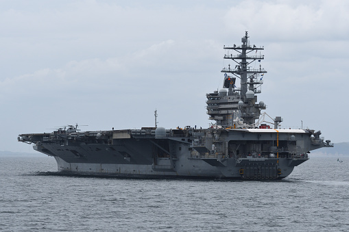 Kanagawa, Japan - May 16, 2021:United States Navy aircraft carrier USS Ronald Reagan (CVN-76) sailing in Tokyo Bay.