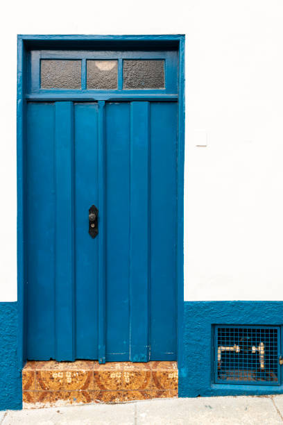 istock Old door on facade of colonial house 1341135541