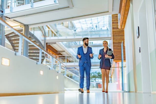 istock Business persons walking in the hall 1341138625