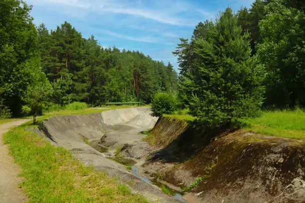 Photo of An empty artificial canal without water for sports.